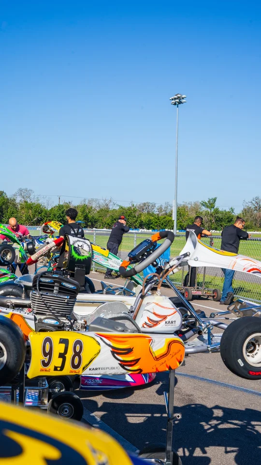 Race karts lined up in the paddock